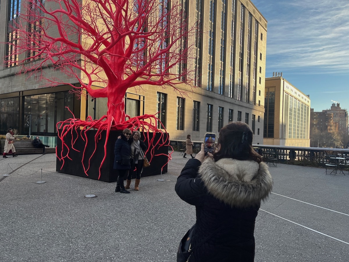 big pink tree public art high line people taking pictures