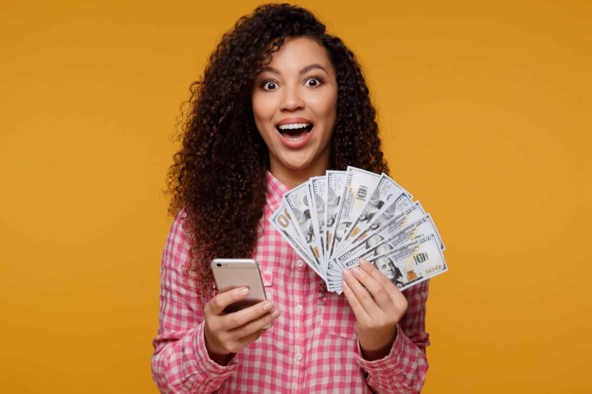 young-girl-holding-cash-in-pink-shirt-credit-score